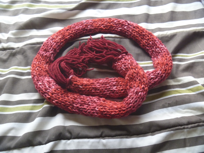 curled up finished red fringed scarf